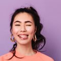 happy-asian-girl-making-funny-faces-front-view-of-2024-09-23-12-40-50-utc.jpg